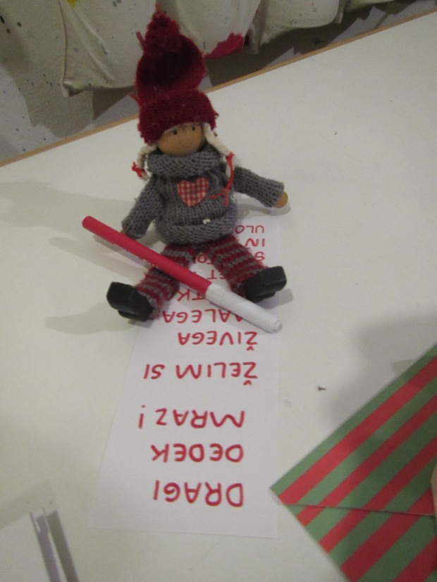 Elf writing to grandpa Frost.