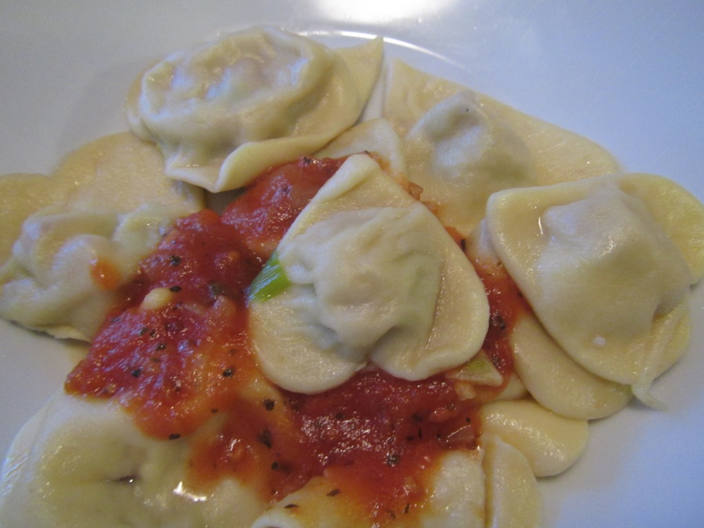 Heart-shaped spinach-ricotta ravioli with tomato sauce- because we like to show love with food;)