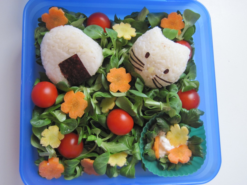 One of my first bento boxes - a classic with rice balls and nori algae:)