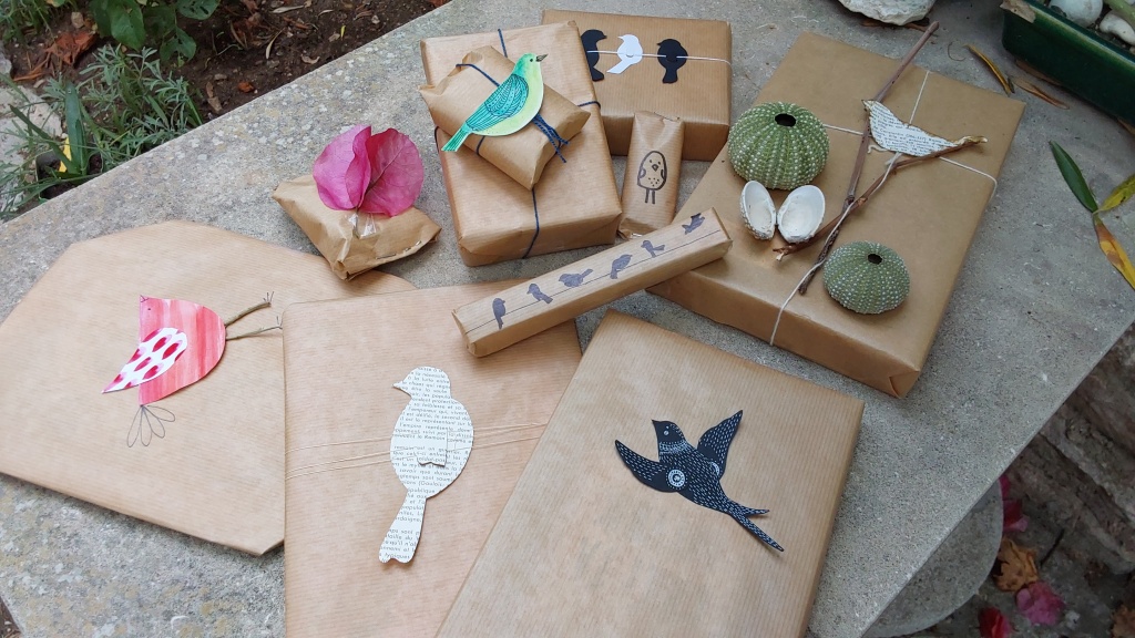 Eco-friendly gift wrap made from recycled brown paper and natural materials.