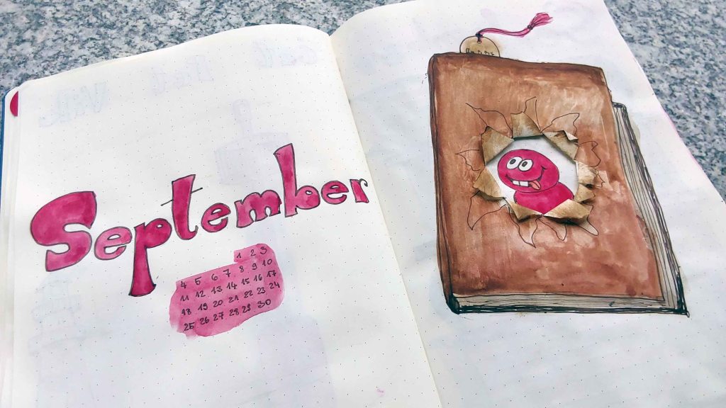 September cover with a bookworm peaking through the hole.